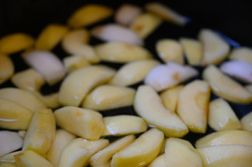 peeled and sliced apple slices floating in water
