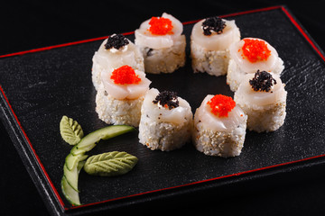 Japanese food, tasty of meal for lunch. Seafood. Sushi with eel, salmon, trout, tuna black background.