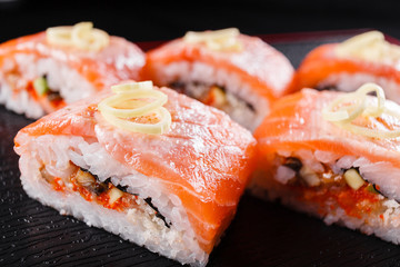 Japanese food, tasty of meal for lunch. Seafood. Sushi with eel, salmon, trout, tuna black background.