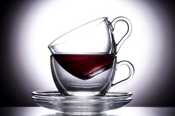 stacked tea cups on blue background