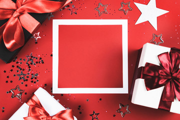 Present boxes on red background.