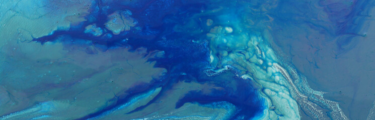 art photography of abstract marbleized effect background. turquoise and blue creative colors. Beautiful paint.