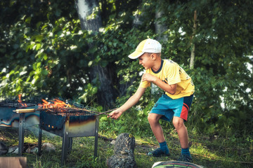 mischievous kid boy playing with fire concept fire safety