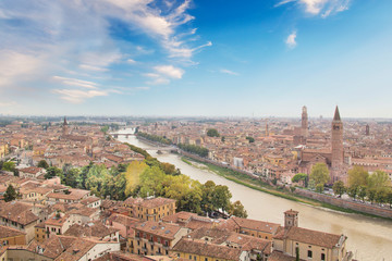 Fototapeta na wymiar Beautiful view of the panorama of Verona and the Lamberti tower on the banks of the Adige River in Verona, Italy