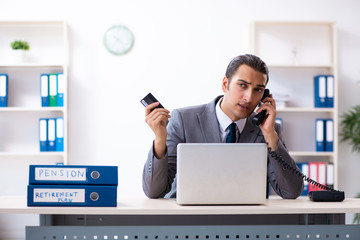 Young male accountant working in the office