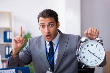 Young male accountant working in the office