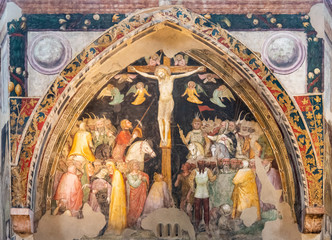 Ruins of medieval religious fresco showing crucifixion scene