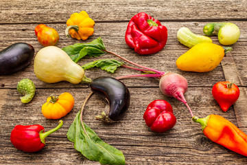 Trendy ugly organic vegetables. Assortment of fresh pepper, eggplant, cucumber, tomato, pumpkin,...