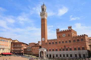 Obraz premium Piazza del Campo with the Pubblico palace and Mangia tower , the principal public space of the historic center of Siena, Tuscany, Italy. It is regarded as one of Europe's greatest medieval squares