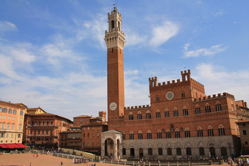 Piazza del Campo with the Pubblico palace and Mangia tower , the principal public space of the historic center of Siena, Tuscany, Italy. It is regarded as one of Europe's greatest medieval squares