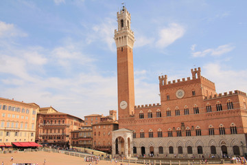 Piazza del Campo with the Pubblico palace and Mangia tower , the principal public space of the historic center of Siena, Tuscany, Italy. It is regarded as one of Europe's greatest medieval squares