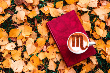 cup of cappuccino coffee with scorpion zodiac