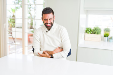 Fototapeta premium Handsome man smiling cheerful with a big smile on face showing teeth, positive and happy expression