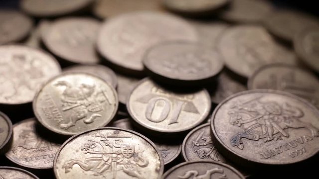 Close Up Of Lithuanian Centas Coins Rotating On Black Background.