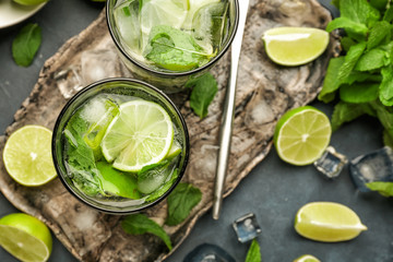 Glasses of fresh mojito on table