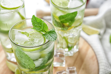 Glasses of fresh mojito on table, closeup