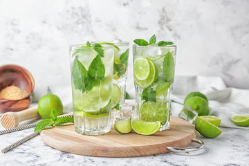 Fototapeta premium Glasses of fresh mojito on table