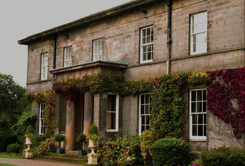 old house with two columns at entrance