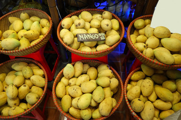 Thai traditional fruit market. Thai Asian tropical traditional fresh ripe fruit mango