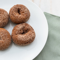 Apple cider donuts on a plate
