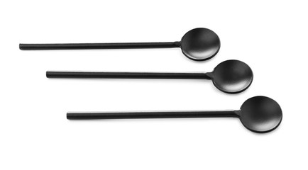 Black spoons on white background