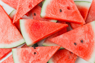 Close-up of fresh slices of red watermelon, top view, summer or food concept, flat lay