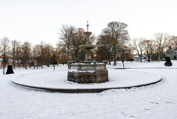 Scenic fountain in the middle of Victoria park early morning in winter season, Aberdeen, Scotland