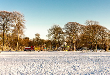 Large children playground covered by snow in Seaton Park, Aberdeen, Scotland