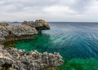 The rocky coast of the Mediterranean Sea on the island of Cyprus.