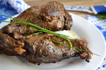 Stewed rabbit (wild hare) meat in creamy sauce with herbs, traditional russian hunting cuisine