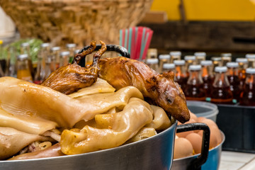Roasted guinea pigs and tripe in a street restaurant in Cuenca Ecuador. It is a highly appreciated food.
