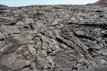 Black lava flow solidified in Santiago Island, Galapagos.