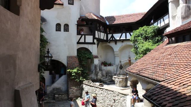 BRAN CASTLE, TRANSYLVANIA, ROMANIA - June 26, 2017: Tourists inside the castle that gave rise to the legend of Dracula from the pen of Bram Stoker. HD video