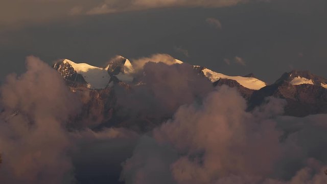 Mountains between moving clouds, Pico Cristobal Colon, Pico Simon Bolivar, Highest peaks of Colombia at 5700 meters of elevation