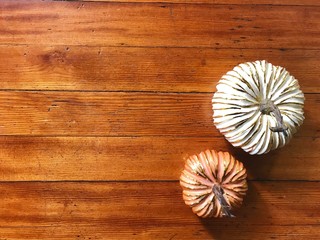 Pumpkins on wooden background