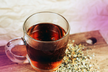 Black tea in glass mug. Fresh organic hot black tea in glass mug