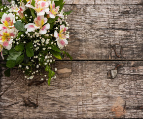 Fototapeta na wymiar White flowers on wooden background, left nd top position