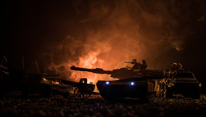 Military patrol car on sunset background. Army war concept. Silhouette of armored vehicle with soldiers ready to attack. Artwork decoration. Selective focus