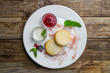 cheesecakes from cottage cheese on white plate