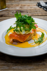 eggs Benedict with salmon and avocado