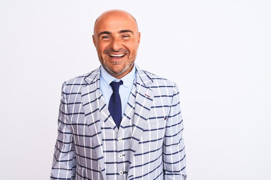 Middle age businessman wearing suit standing over isolated white background with a happy and cool smile on face. Lucky person.