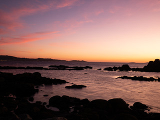 Fototapeta na wymiar sunset from the beach with rocks