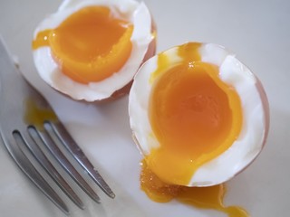 Soft boiled egg on white background