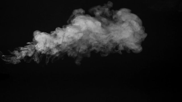 White car exhaust smoke on a black background
