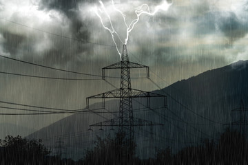 Lightning strikes into an high-voltage tower in the mountains