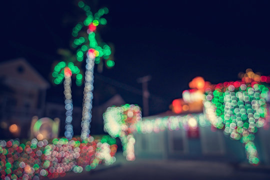 Seasonal Christmas House Lights Decoration, Outdoor Blurred Defocused View. Xmas Showcase. Tropical Climate