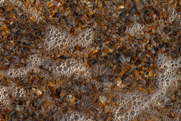 sea pebbles colored granite on the beach