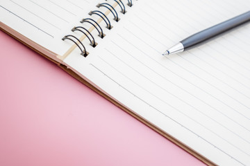 open vintage notebook and luxury black pen with blank pages