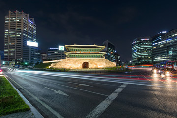 Traffic at old fortress Namdaemun gate in Seoul South Korea.
