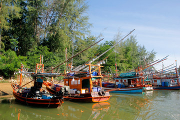 fishing boat in canal with beautiful sky background